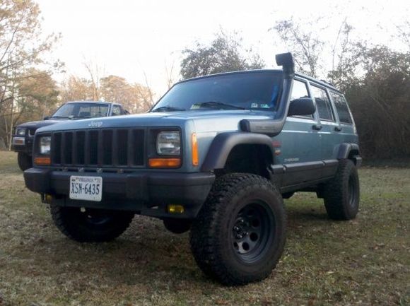 And this is Jeeper Sutherland(Working Name) as of January 2011. !o far I've bedlined the cargo area, put a few McGuyver goodies in the cockpit, H4 E code headlights,  and installed TJ fender flares. I'm sure I'm forgetting.a few thinga that I've done, and its got a long ways to go before its at 100% but so far, I LOVE MY JEEP!