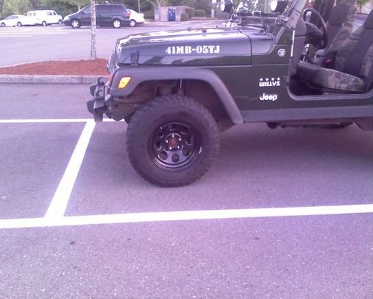 Wheel and tires Im looking to get.     this Jeep is owned by a checker at my local grocery store..  Nice.