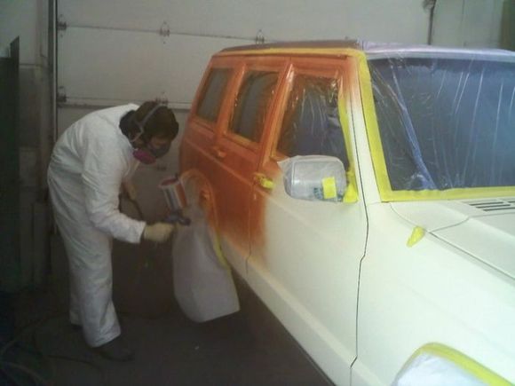 First coat of orange metallic paint.