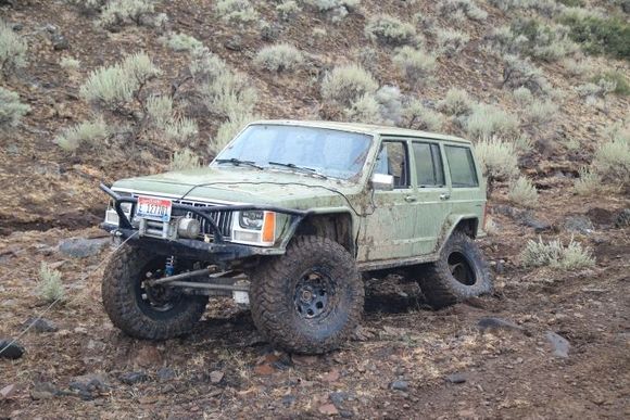 Before wj knuckles actually broke a xj knuckle after this photo was taken kicked off the wj chromo axles shes pretty broken running on pretty much all winch to get out.