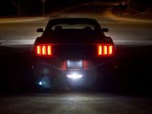 A smaller backup single lamp from a 2015 Mustang might work! 