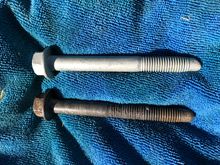 Bottom bolt, note the middle of the bolt is thin due to the stretch of that extra 180 degrees of torque, while the top bolt has it’s shank in the same area, so grease or anti seize them well! 