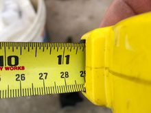 I measured with two hands and locked the tape measure 11 5/16 inches