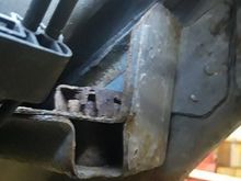As you can see from fastsuv’s photo , with the engine cradle removed there’s room in the cage, however getting in there with the cradle in place, you have the rear transmission mount, steering rack and swaybar with brackets and bushings in the way. I’m able to reach in from the wheel well enough to insert that Allen wrench. 