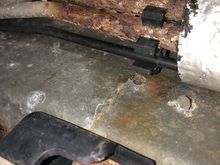 That’s the EVAP canister, the black plastic and metal bracket, the lines are above that the insulation sleeve is just in the upper right of the photo 