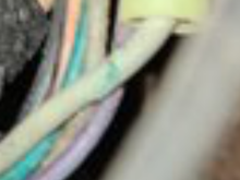 That does look like a cut in that grey wire . The black larger wire doesn’t look to belong to that harness
