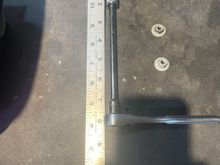Get a 10 mm socket with an extension, 1/4".