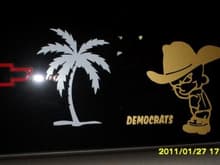 A pic of the left rear side glass. The Palmetto tree is for my state. The &quot;Calvin&quot; speaks for it's self
