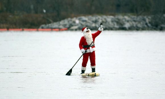 Santa was paddle boarding in the Niagara River in Fort Erie this afternoon, we Canadian’s aren’t bothered by 33 F it’s still sun tanning weather! You tan better with the goose pimples from the cold. 