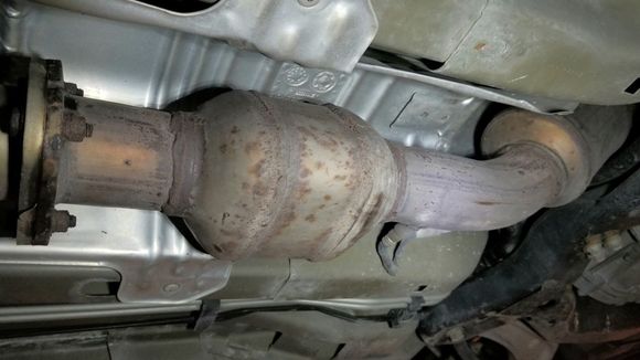 These are the catalytic converters under your SS . 
I’m thinking someone’s going to cut them they aren’t taking them to a reputable place to sell them, so marking them would be a waste of your time. 