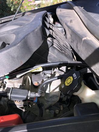 This piece I cut from a Cobalt at a parts yard, longer to move that connector back by the fire wall