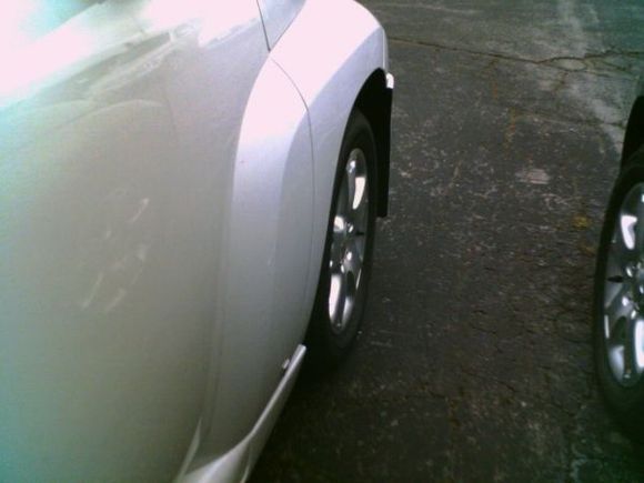 See here how the skirt is not flush to the fender or the door