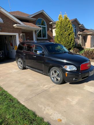 This look is just red rattle can paint on the grille and a chrome strip at the belt line