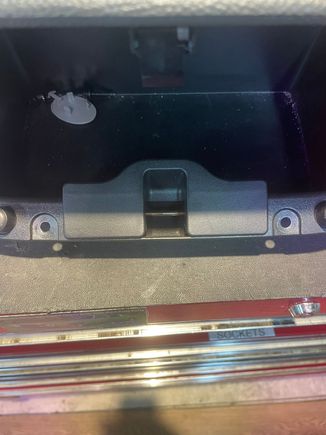 Remove the dash compartment by removing the 2 Phillips screws. The unit then pulls out.