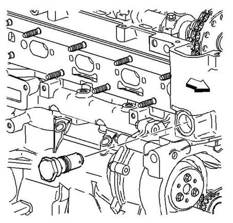 The tensioner is on the back of the engine. Loosen with a 32 mm socket.
