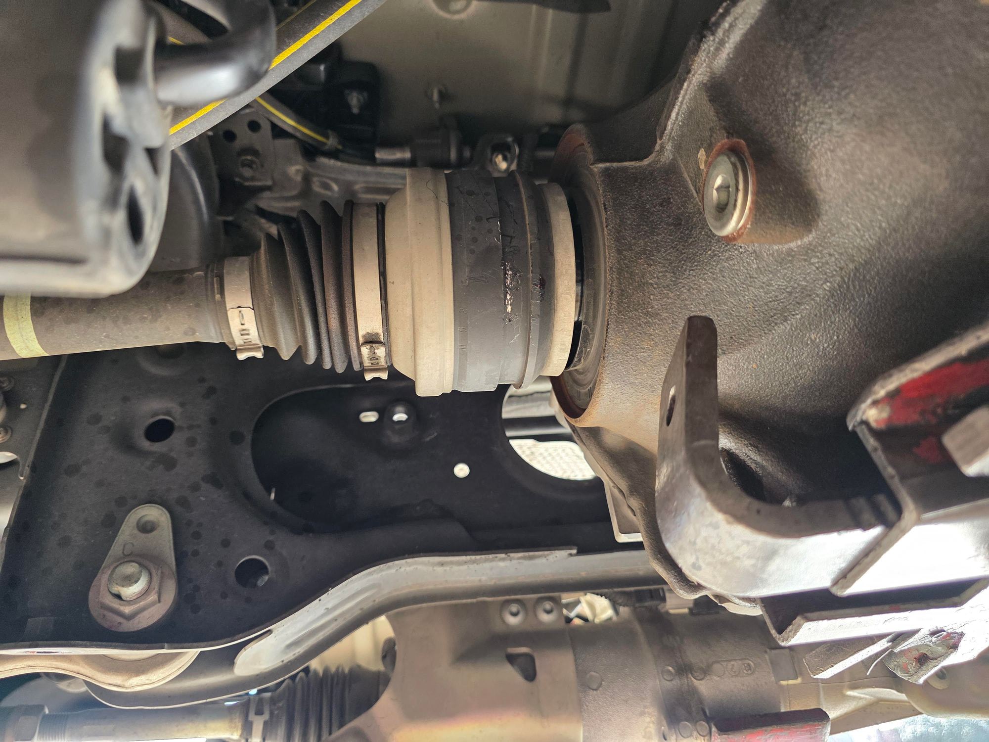 7. Before removing the forward 19mm differential mounts, I slightly removed axles on both sides, this kept the differential stable during axle removal