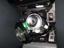 The light pipe slides off of ignition switch.. Gently move the bulb wiring harness over the top of keyswitch to allow adequate room to unsrew the socket from the light pipe.