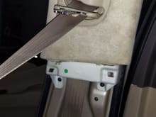 2 screws hold in the upper b pillar panel.  The lower B panel must be pulled off to access these 2 screws.  With the seat belt unbolted from the seat you feed the seat belt through the panel and it is free from the car.
