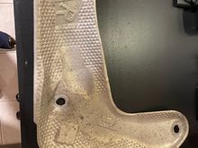 So I had a rattle from the back of the truck that sounded like classic heat shield loose or broke. I went under near the rear of the truck and the smaller heat shield in the picture was just laying on the top of the exhaust pipe where it bends and comes out near the rear wheel well. As you can see classic corroded bolt holes. So I removed it.  I’m sure I can use some JB Weld steel epoxy and it would be good. The nuts are rusted too bad to remove. Can I just leave it off?