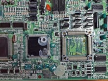add-on performance board removed to access security system's memory chip