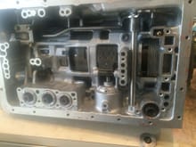 This is about what the unit looks like prior to valve body installation. Don't forget the check-ball and the top right.