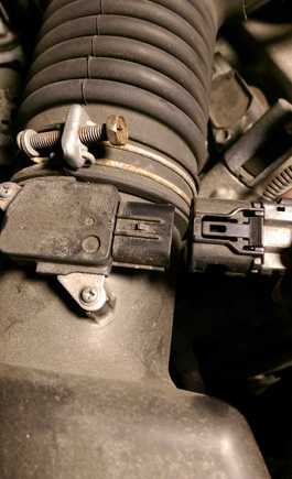 unplug the intake sensor and unscrew to loosen the rubber tubing connecting to the intake