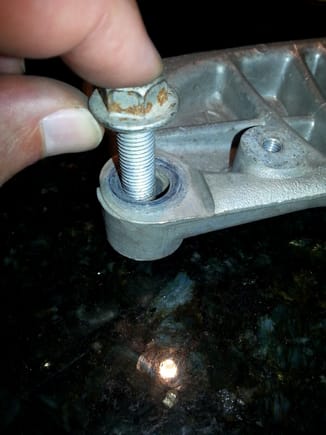Toyota used a fastener without a grip (unthreaded) where washer head bolt passes through support...and because the bolt diameter is only 70% of the bolt hole, only underside of the head of bolt provides clamping..and noticeable fretting on bracket surface and in through-hole