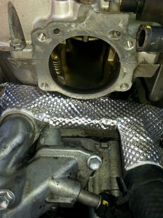 Take your time with the template and (almost) professional.results...The front coolant crossover is no longer cooking the throttle body components and heating the intake manifold...