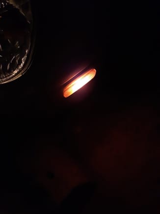 Incandescent bulb at night with amber silikrome light filter