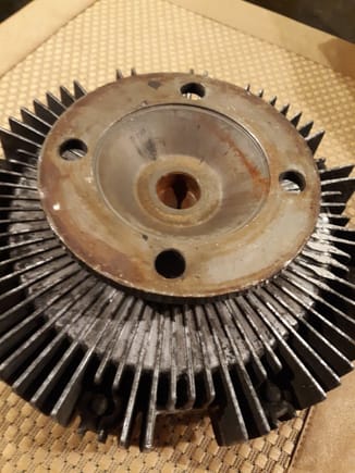 Backside of fan clutch...a spacer will require a conical shape positioning pin,  ndex and inverse conical shape to mate with fan bracket hub... Standard fan clutch used from early LS400, which may explain why not modified to better position fan blades within shroud venturi area.