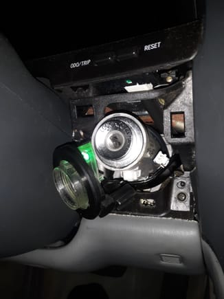The light pipe slides off of ignition switch.. Gently move the bulb wiring harness over the top of keyswitch to allow adequate room to unsrew the socket from the light pipe.