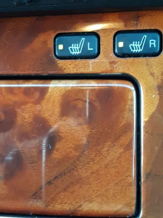 Close-up image of seat heater switches working.