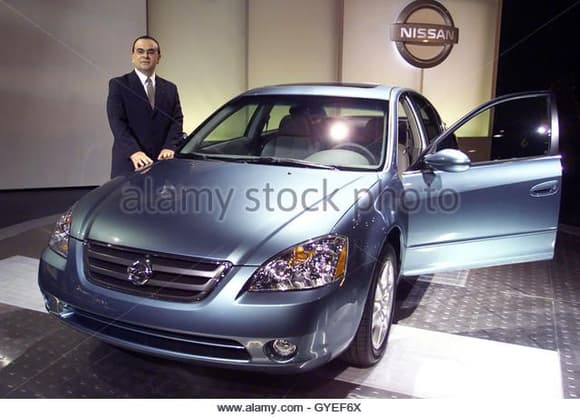 April 2001 COO Carlos Ghosn stands next to 2002 Nissan Altima 3.5 V6.