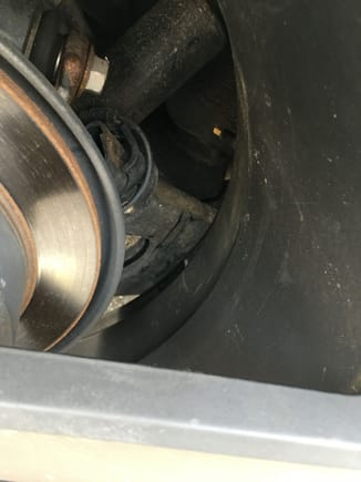 This is the picture of the inner valve stem with the tpms is rubbing the arm. Cant get a flush mount valve because i need my tpms. Or else my light will stay on, and i hate that. Should i do 15mm spacer or 20mm spacer?