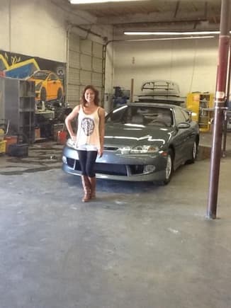 Elissa Alva, project manager at TnT Auto Body, posing in front of her almost completed project!!!!!  She was wonderful throughout the whole process.