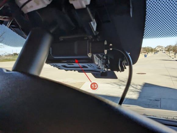 The USB part of the adapter comes with a double-sided 3M adhesive. Attach it to the top of the adaptive cruise control's camera (#13) to prevent it from dangling and rattling.