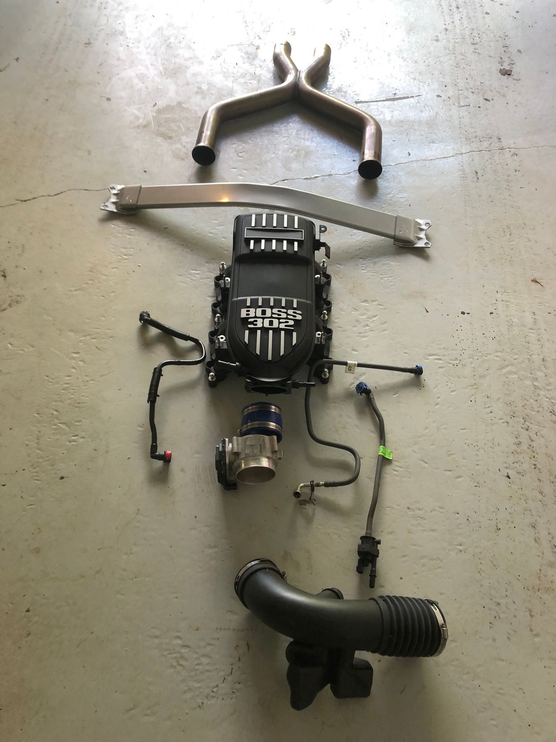 Boss 302 intake 85mm throttle body and Pipe exhaust for sale.Tower bar already sold.asking 600.00