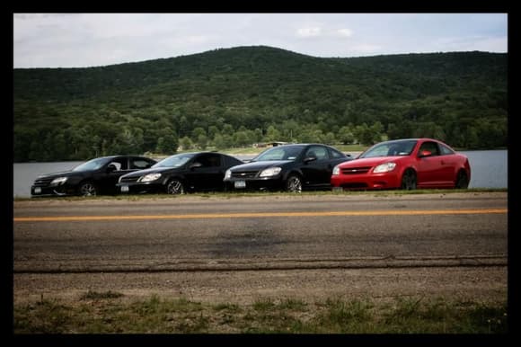 Photo by Slowswap

Left to Right 
Dave (Slowswap) Oddball Ford heh
Jay (donkeyballs)
Bill (me... Rukkee)
Matt (RedSSNA) 

State park outing .... Sam ( Mr.N00BLar) and Chevellegirl (Matt's fiance) where there as passangers. 

My car is flanked by two lowered SS's.......Matt's (redssna) on the right and Jay's (Donkeyballs) on the left.... they make my poor car look like a 4X4 lol