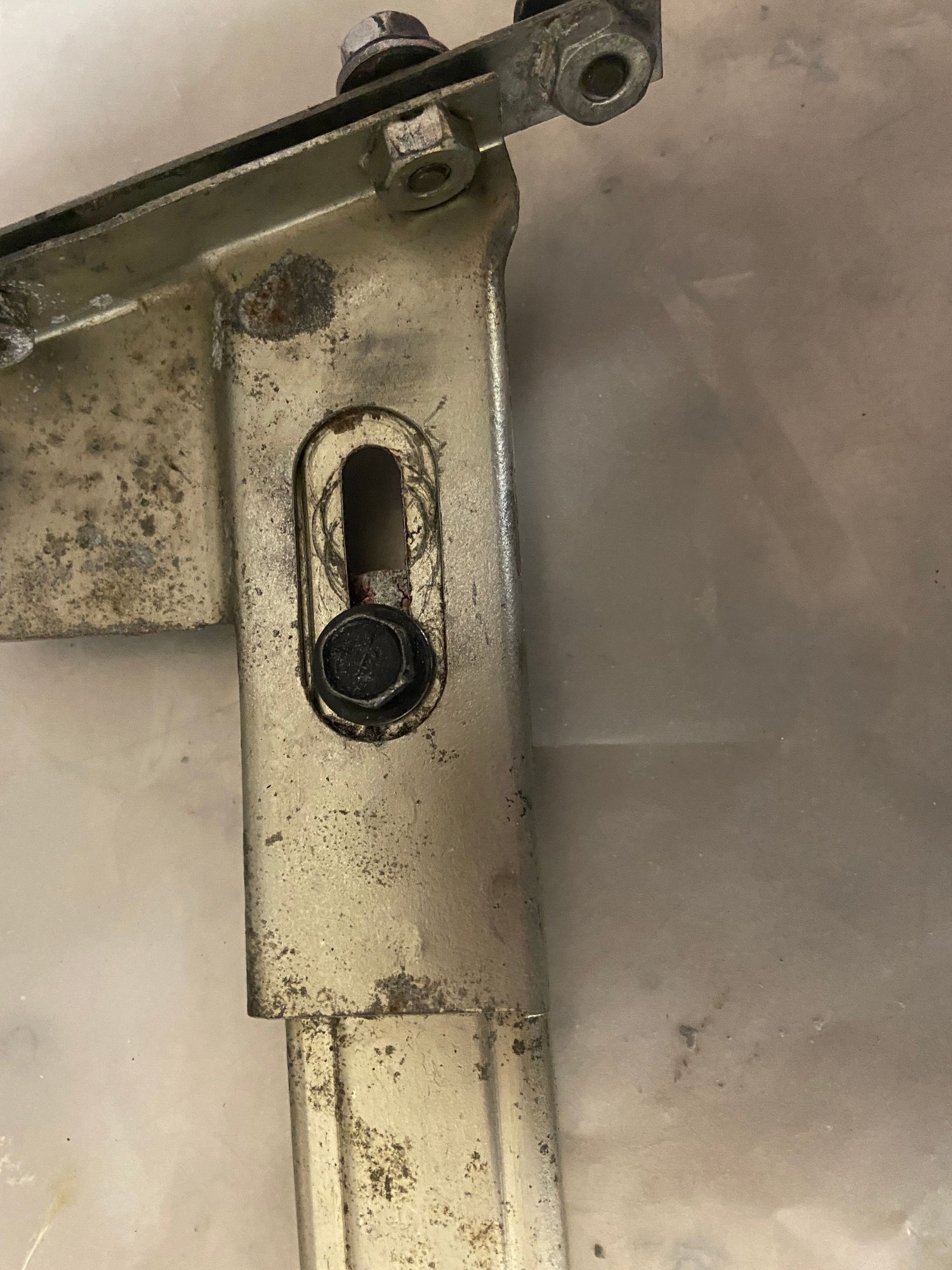 this is the back side, the bolt/screw you need to locate