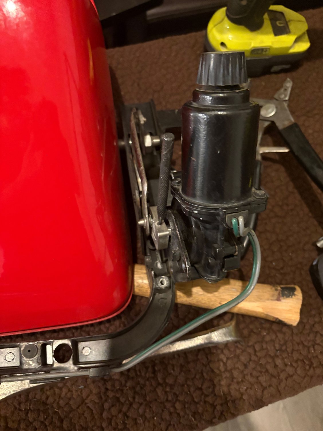 Metal pin punch broke off when attempting to remove headlight motor