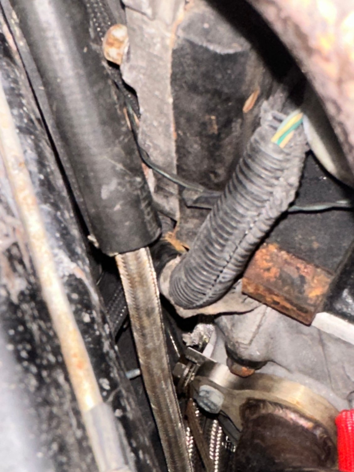 Green/White and Black wires running to drivers side of transmission.