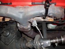 Wheels turned fully to the left and cable loop installed over the bolt in the coupler and then the flanged nut installed. I found the nut is not necessary, but not much trouble.