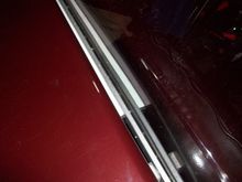 I drilled and tapped the 3/8” bar for ¼”x20 tpi all thread with the spacing matching the original holes in the deck lid front flange. Had to ream the holes in the fiberglass our about 1/32”.

Added a 7/16”x7/8”x28” thin steel (approx. 24 ga.) rectangular tube spacer behind a 3/8”x1”x 43” long aluminum bar to attach the hinge to.

Had to put individual shims at each end of the 3/8” aluminum bar as the deck lid curves in to keep the hinge mounting surface straight.
