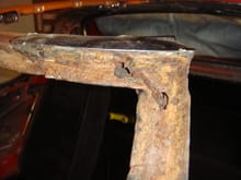 Windshield Frame rust holes hiding underneath adhesive driver upper corner