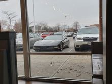 Looking out the Diner window at the gray skies, ,,, ,,
and the C5.    😉