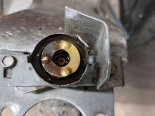 There is a spring under the contact washer. The contact washer has two tabs that align with notches in the plastic rotator on the lever shaft to actuate the lights.