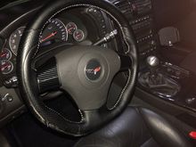 Added new steering wheel and wrapped the silver spokes in Carbon Fiber