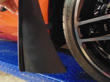 Snap in new wider front guard.  Tab goes into slot in the wheel well. (Right front)