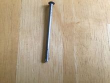 The nail will Make a perfect depression in the center of the rivet.