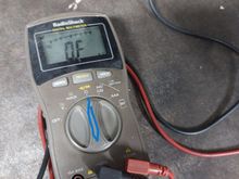 This upside down horse shoe is called Ohms for resistance measurements with no power on the circuit.
